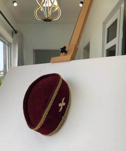 A Burgundy and Gold Ceremonial African Traditional Hat