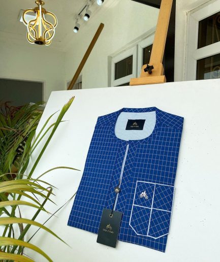 A blue and ivory check kaftan with front flap detailing and sokoto