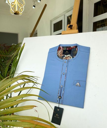 A Skye blue with paisley detailing, front flap with a matching Swarovski button detailing African kaftan and sokoto