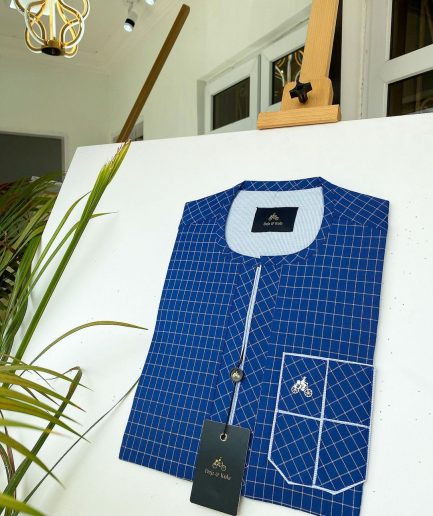 A blue and ivory check kaftan with front flap detailing and sokoto