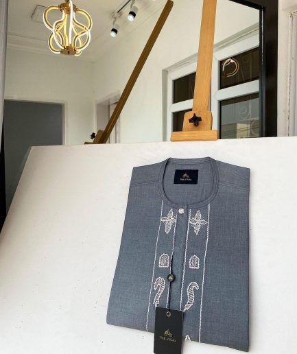 A Dark grey Irish petal embroidery detail and a mid-section flap button Swarovski African kaftan
