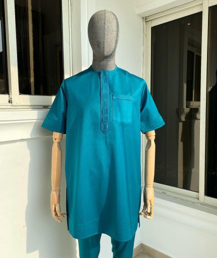An emerald green front flap and traditional embroidery senator kaftan
