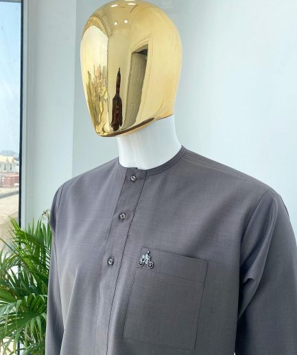A Space Grey senator with a Swarovski button details African Kaftan