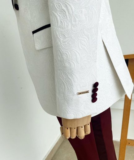 An Ivory white floral pattern jacquard shawl lapel tuxedo suit