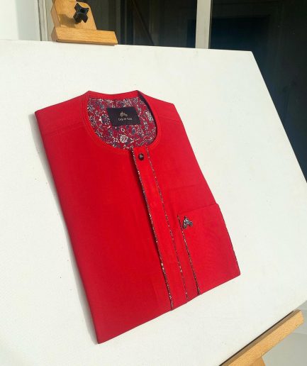 A tomato red flat design senator Kaftan with black Swarovski button African Kaftan
