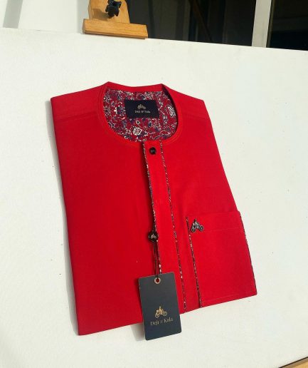 A tomato red flat design senator Kaftan with black Swarovski button African Kaftan