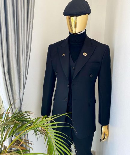 A charcoal black Bespoke reloaded “peaky blinders” peak lapel suit
