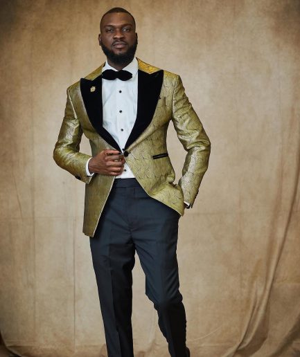 A gold metallic jacquard peak lapel tuxedo suit