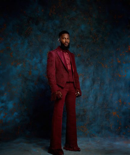 A monochrome, knitted, hand-woven aso-oke, matching bead layering tuxedo suit