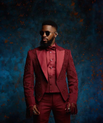 A monochrome, knitted, hand-woven aso-oke, matching bead layering tuxedo suit