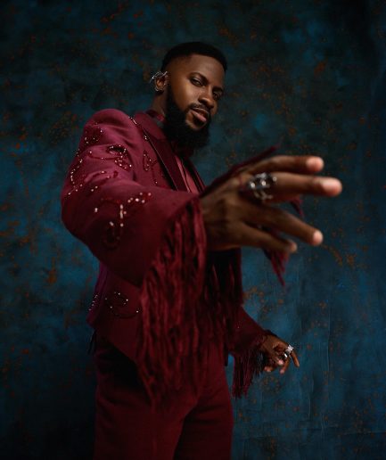A monochrome, knitted, hand-woven aso-oke, matching bead layering tuxedo suit