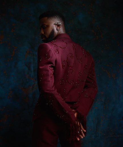 A monochrome, knitted, hand-woven aso-oke, matching bead layering tuxedo suit