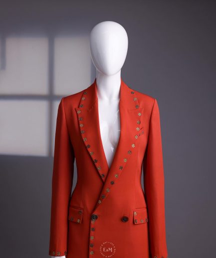 A rust orange peak lapel with shades of brown ss16 Swarovski stone details double-breasted jacket.