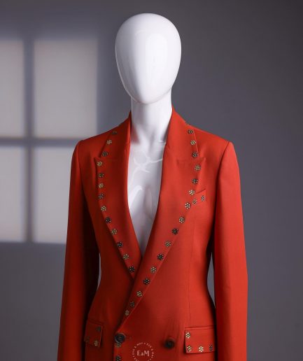 A rust orange peak lapel with shades of brown ss16 Swarovski stone details double-breasted jacket.