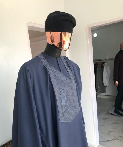 A Navy Blue with connected embroidery Agbada and Hand woven Yoruba Hat