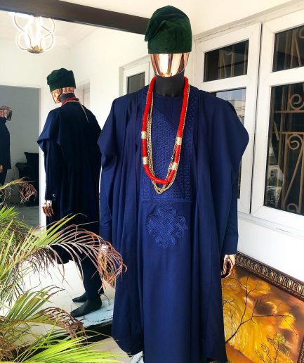 A Navy Blue embroidery details Agbada and Hand Woven Army Green Velvet Yoruba Hat and sokoto