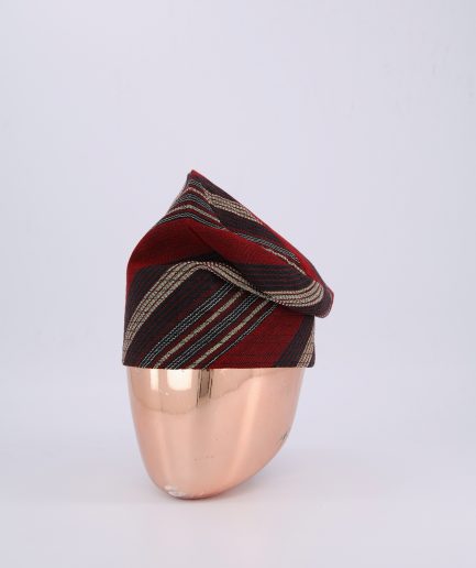 A Burgundy Knitted Yoruba Fila with a Striped Pattern.