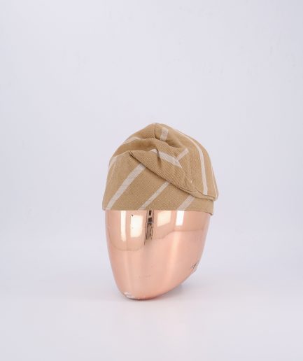 A tortilla-colored Yoruba traditional hat