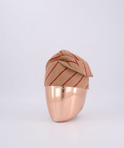 A Gold aso oke Yoruba fila with bold red stripes.