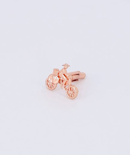 A Large Bronze Bicycle Cufflink