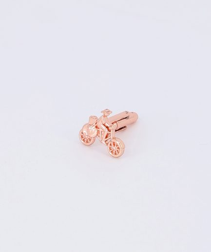 A Medium Bronze Bicycle Cufflink