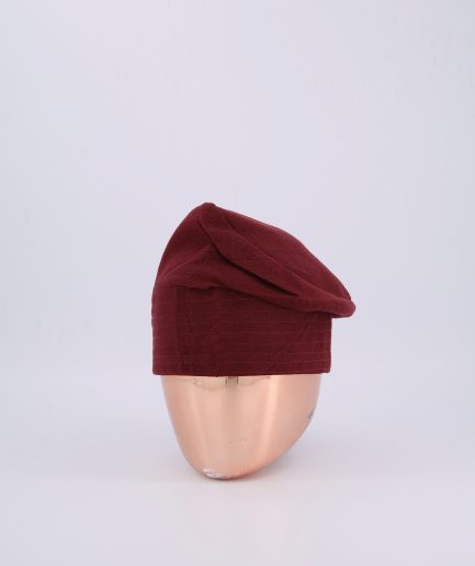 A burgundy hand-knitted Yoruba Fila