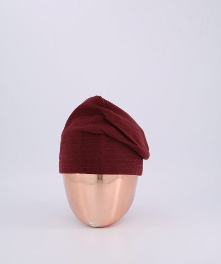 A burgundy hand-knitted Yoruba Fila
