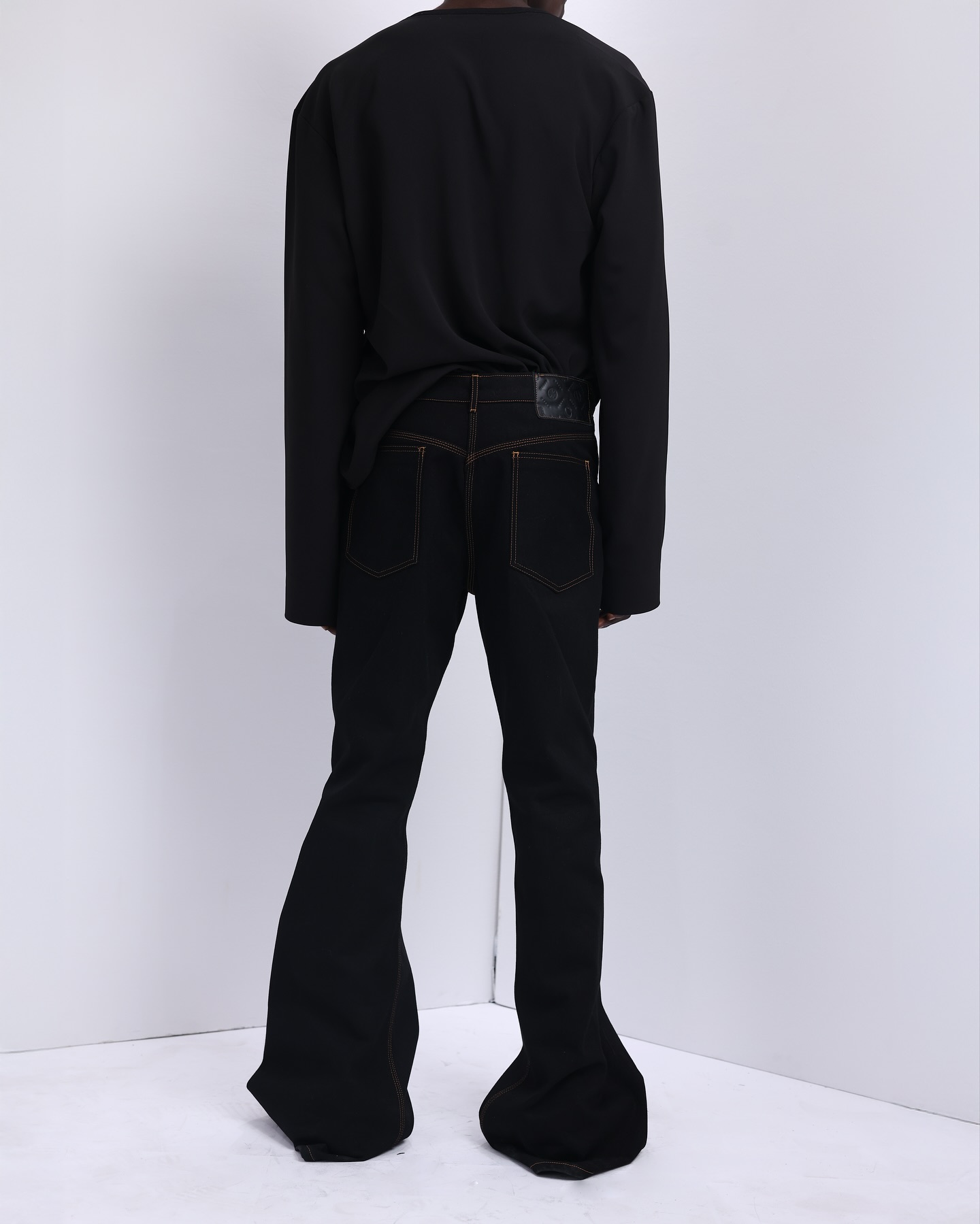 Shop Black V-Cut Neck T-Shirt with Metal Badge | Deji & Kola