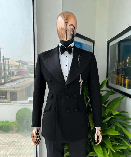 An Inverted “Pirate”, knitted, charcoal black jacquard with peak lapel, 9 button tuxedo suit.