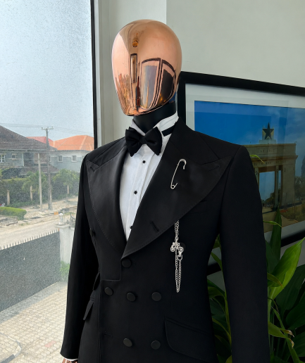 An Inverted “Pirate”, knitted, charcoal black jacquard with peak lapel, 9 button tuxedo suit.
