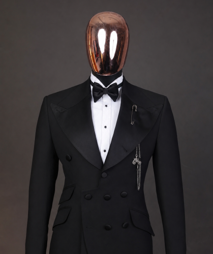 An Inverted “Pirate”, knitted, charcoal black jacquard with peak lapel, 9 button tuxedo suit.