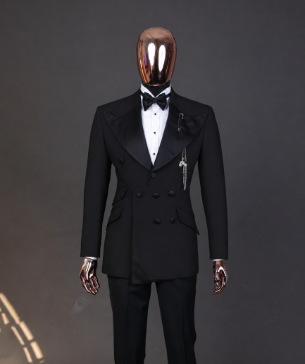An Inverted “Pirate”, knitted, charcoal black jacquard with peak lapel, 9 button tuxedo suit.