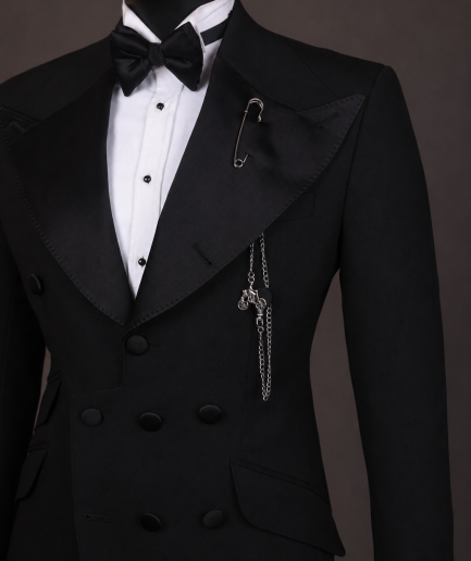 An Inverted “Pirate”, knitted, charcoal black jacquard with peak lapel, 9 button tuxedo suit.