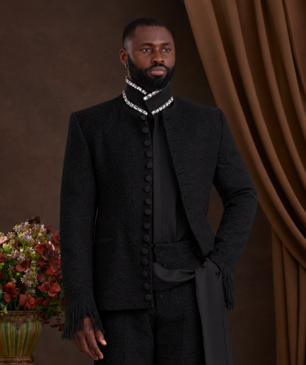A black safari tweed suit